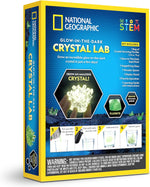 Unboxed crystal growing kit contents with tools and fluorite sample