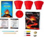 Unboxed contents: mold, plaster, paints, brush, and eruption powders