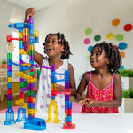 Child playing with the glow-in-the-dark marble run set