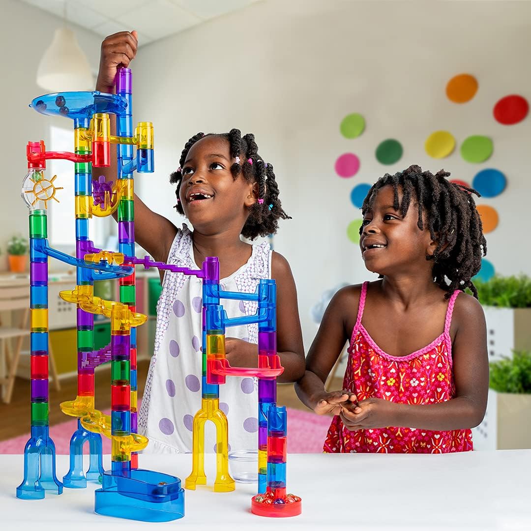 Child playing with the glow-in-the-dark marble run set